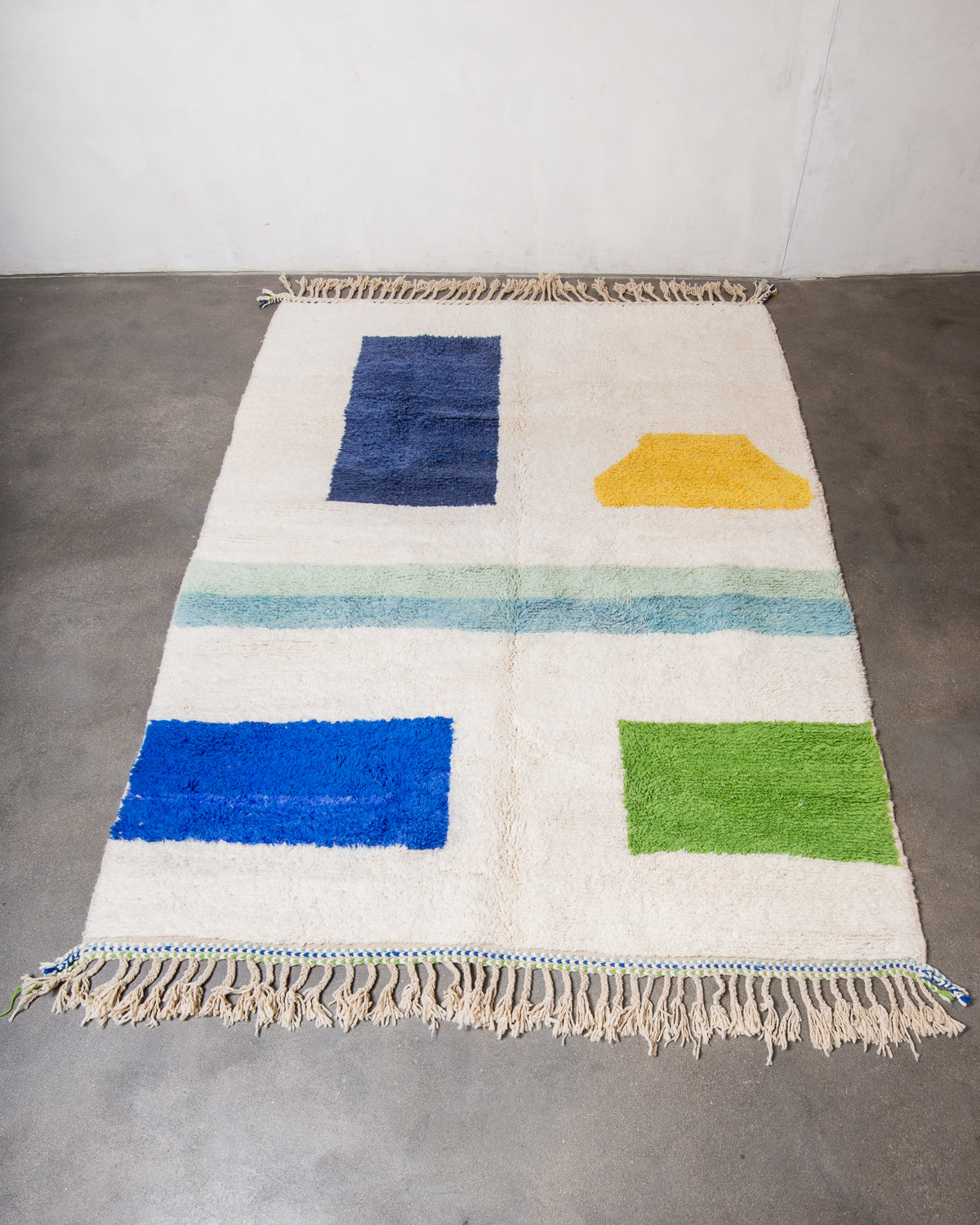 Modern, designer, handcrafted Berber rug from Morocco. Beniourain carpet with beautiful colours and patterns and fluffy wool texture.